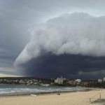 A wave-like cloud looms over Sydney's Manly Beach during an afternoon storm front