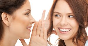 two women spreading gossip