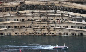 The damaged side of the capsized cruise liner Costa Concordia is seen at the end of the "parbuckling" operation outside Giglio harbour