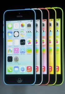 The five colors of the new iPhone 5C are seen on screen at Apple Inc's media event in Cupertino