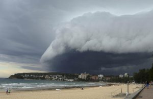 A wave-like cloud looms over Sydney's Manly Beach during an afternoon storm front