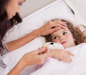 Mother taking care of her sick daughter