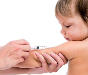 doctor vaccinating  baby isplated on a white background