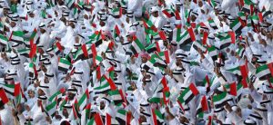 Emiratis wave national flags as citizens celerbate their countr'es 40 years of independence, on National Day in Abu Dhabi on December 2, 2011. AFP PHOTO/Karim Sahib (Photo credit should read KARIM SAHIB/AFP/Getty Images)