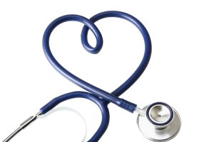 A stethoscope in the shape of a heart, isolated on white background
